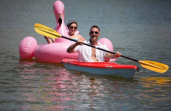 couple kayaking on water in naples