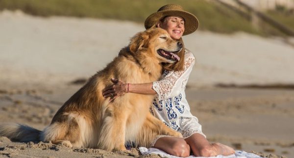 woman and dog on beach in vero beach