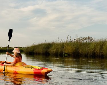 girl kayaking in state park river