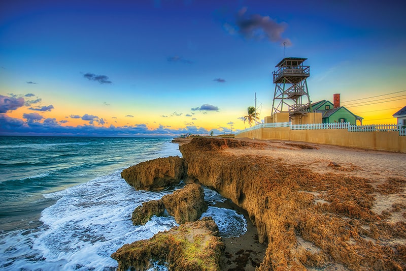 lookout tower and rocky shore at house of refuge