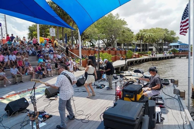 band playing on stage at riverwalk