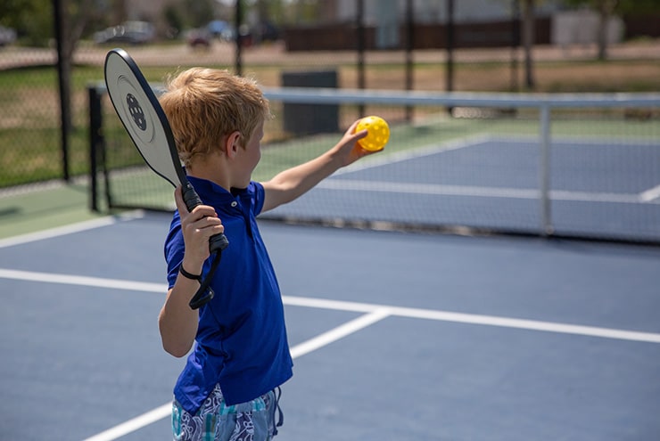 boy playing pickleball in martin county