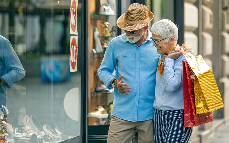 mature couple window shopping near buckhead