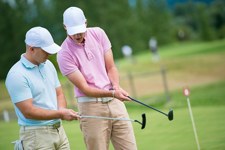 two men at martin county semi private course learning swing technique