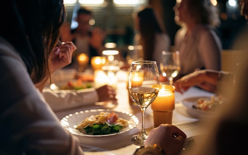 People Eating Out At Restaurant