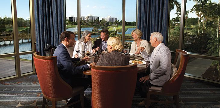six people talking and eating dinner at Boca West