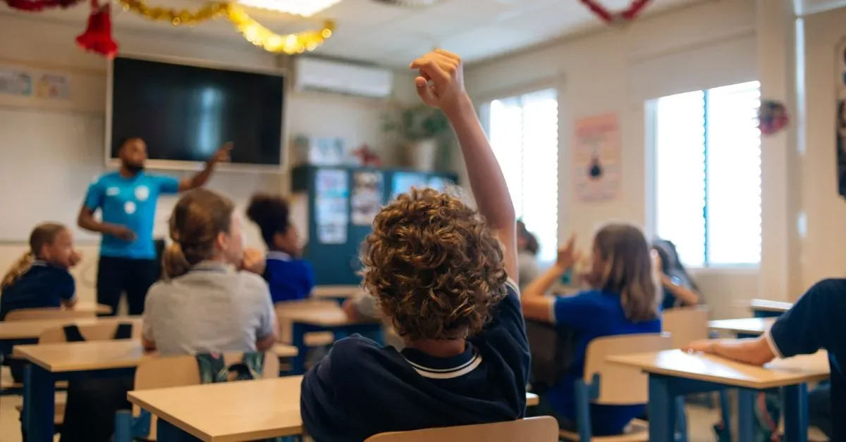 Tributary School Kids Hand Raising
