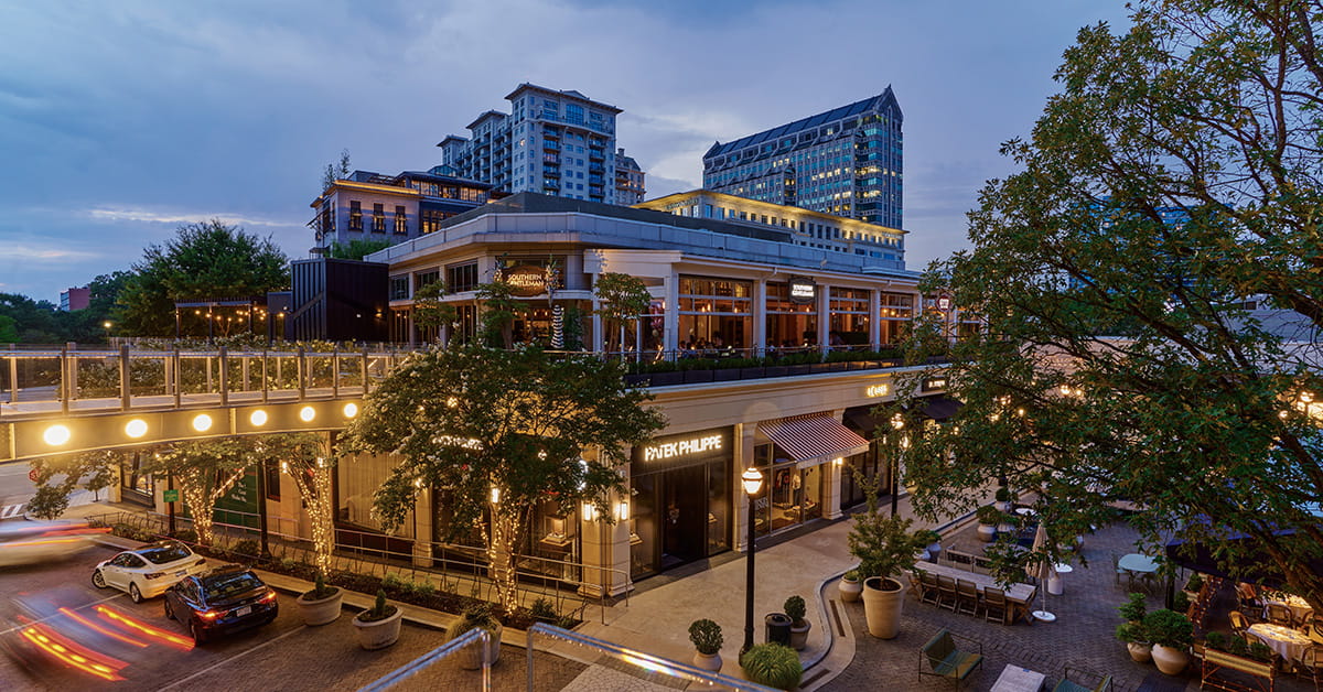 Luxury shopping and dining district in Buckhead Atlanta illuminated at dusk.