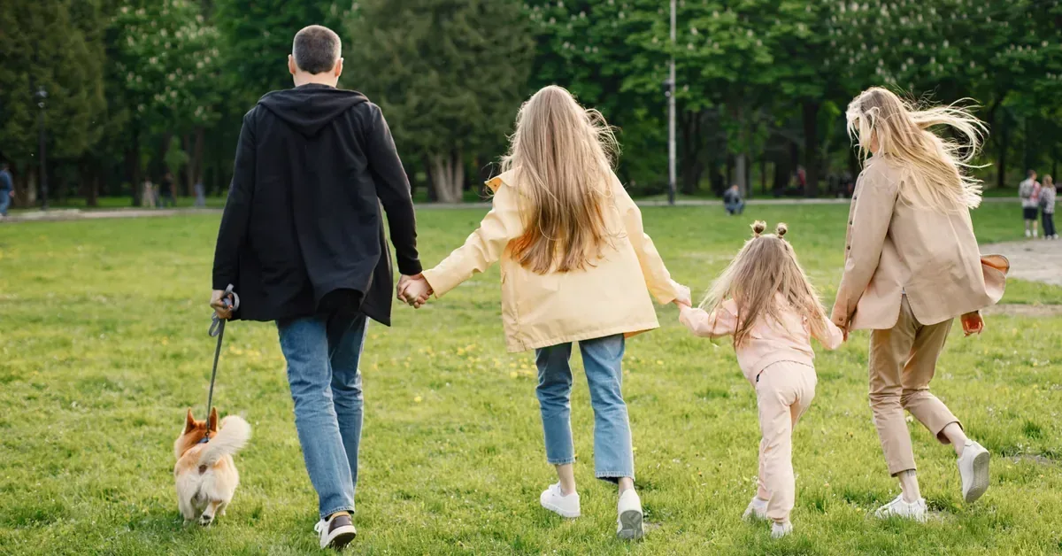 Family Outside Walking Dog
